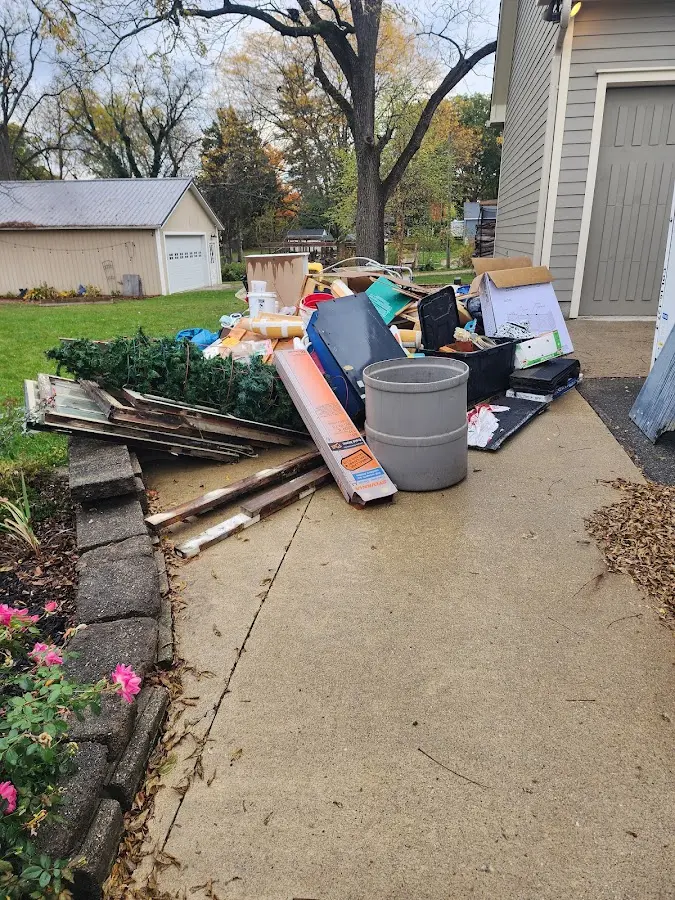 Dumpster being loaded with debris for Demolition Dumpster Rental in Baldwin